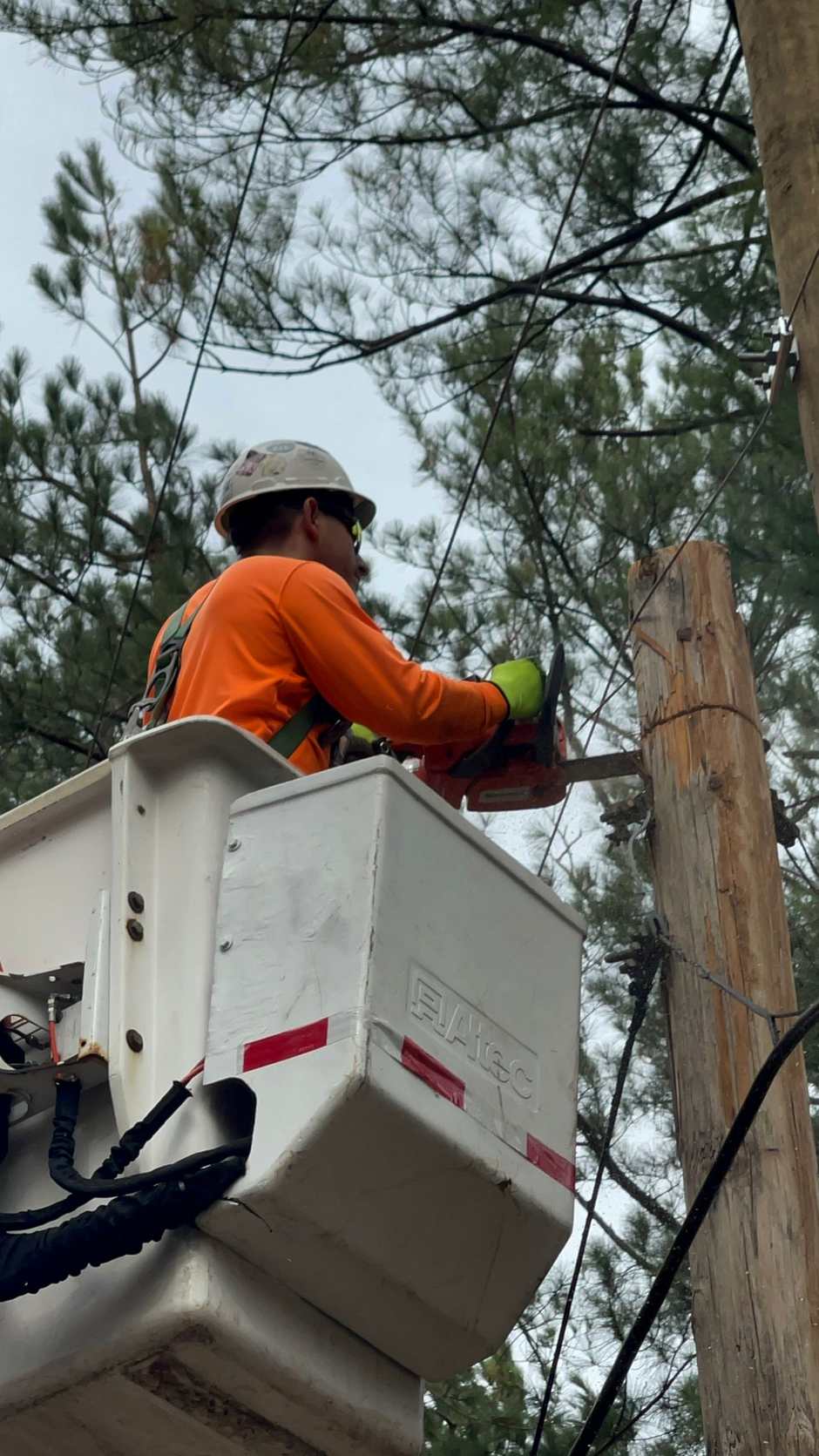 Precision line work high above the storm damage